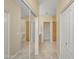 Hallway showing a mirrored closet, bathroom, and additional closet space at 705 W Queen Creek Rd # 1201, Chandler, AZ 85248