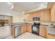 Well-lit kitchen featuring stainless steel appliances, ample counter space, and an open layout at 705 W Queen Creek Rd # 1201, Chandler, AZ 85248