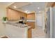 Functional kitchen with stainless steel appliances, breakfast bar, and ample cabinet space at 705 W Queen Creek Rd # 1201, Chandler, AZ 85248