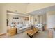 Bright and airy living room with open floor plan, neutral tones, and dining area at 705 W Queen Creek Rd # 1201, Chandler, AZ 85248