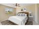 Bright main bedroom featuring a ceiling fan, neutral tones, and an expansive window view at 705 W Queen Creek Rd # 1201, Chandler, AZ 85248