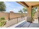 Outdoor patio with gravel, a fence, privacy walls, and views of the community landscaping at 705 W Queen Creek Rd # 1201, Chandler, AZ 85248