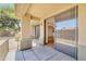A covered patio with sliding doors leading into the home's living area at 705 W Queen Creek Rd # 1201, Chandler, AZ 85248