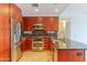Gourmet kitchen with stainless appliances, granite countertops, and custom cabinetry at 7167 E Rancho Vista Dr # 2007, Scottsdale, AZ 85251