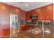 Modern kitchen featuring stainless steel appliances, granite countertops, and warm wood cabinetry at 7167 E Rancho Vista Dr # 2007, Scottsdale, AZ 85251