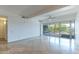 Spacious living room with tile floors, ceiling fan, and sliding door to a patio at 7167 E Rancho Vista Dr # 2007, Scottsdale, AZ 85251