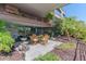 Private outdoor patio with dining area and peaceful garden surroundings at 7167 E Rancho Vista Dr # 2007, Scottsdale, AZ 85251