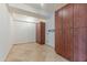 Spacious storage room with ample built-in wood cabinets and tile flooring at 7167 E Rancho Vista Dr # 2007, Scottsdale, AZ 85251