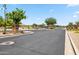 Community entrance gate featuring stone accents and well-maintained landscaping at 8417 W Northview Ave, Glendale, AZ 85305