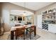 Cozy dining area with a built-in wine rack and an open view into the comfortable living room at 8417 W Northview Ave, Glendale, AZ 85305