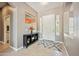 Bright foyer with neutral colors, tile flooring, and tasteful decor creates a warm and inviting entrance at 8417 W Northview Ave, Glendale, AZ 85305