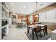 Expansive kitchen featuring an island with bar seating, tile floors, and eat-in dining area at 8417 W Northview Ave, Glendale, AZ 85305