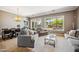 Cozy living room featuring comfortable seating, a neutral color palette, and a seamless flow to the dining area at 8417 W Northview Ave, Glendale, AZ 85305