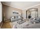 Comfortable living room with plush seating, a stylish coffee table, and a serene ambiance at 8417 W Northview Ave, Glendale, AZ 85305