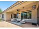 Covered patio with comfortable seating and a ceiling fan at 8417 W Northview Ave, Glendale, AZ 85305