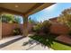 Private backyard with well-maintained artificial turf and desert landscaping at 865 E Del Rio St, Chandler, AZ 85225