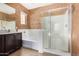 Bathroom with shower, soaking tub, and stylish vanity at 865 E Del Rio St, Chandler, AZ 85225