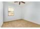Neutral bedroom featuring a window with natural light and tan carpeting at 865 E Del Rio St, Chandler, AZ 85225