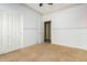 Bedroom with carpet flooring, a ceiling fan, closet and natural light at 865 E Del Rio St, Chandler, AZ 85225