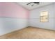 Bedroom with a ceiling fan, neutral carpeting and a window at 865 E Del Rio St, Chandler, AZ 85225