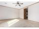 Spacious bedroom featuring a ceiling fan, neutral carpeting and light trim at 865 E Del Rio St, Chandler, AZ 85225