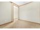 A neutral-toned bedroom features carpet flooring, wood trim, and ample space at 865 E Del Rio St, Chandler, AZ 85225