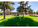 Community park with playground, green grass, ramada and walking paths at 865 E Del Rio St, Chandler, AZ 85225