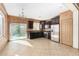 A kitchen features dark wood cabinets, stainless steel appliances, and a sliding glass door at 865 E Del Rio St, Chandler, AZ 85225