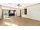 Open-concept living space connecting living room to the kitchen with tiled flooring and recessed lighting at 865 E Del Rio St, Chandler, AZ 85225