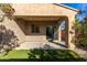 Covered patio area with view of the landscaped backyard and a sliding glass door at 865 E Del Rio St, Chandler, AZ 85225