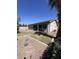 This backyard has low maintenance landscaping with gravel and bushes at 8758 W Myrtle Ave, Glendale, AZ 85305