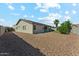 The home features a spacious backyard with low maintenance landscaping at 8758 W Myrtle Ave, Glendale, AZ 85305
