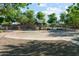 Outdoor basketball court with covered benches, set in a neighborhood park with playground equipment at 8758 W Myrtle Ave, Glendale, AZ 85305