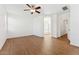Expansive main bedroom boasts wood floors and an ensuite bathroom with a soaking tub and shower at 8758 W Myrtle Ave, Glendale, AZ 85305