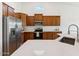 Bright kitchen with a large island, stainless steel appliances, and wooden cabinets at 8758 W Myrtle Ave, Glendale, AZ 85305