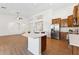 Spacious kitchen with a large island, modern appliances, and wood-look floors at 8758 W Myrtle Ave, Glendale, AZ 85305