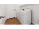 This laundry room has shelving and includes a washer and dryer at 8758 W Myrtle Ave, Glendale, AZ 85305