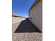 The side yard features low maintenance landscaping with gravel at 8758 W Myrtle Ave, Glendale, AZ 85305