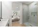 Bathroom featuring a glass-enclosed shower, modern fixtures and a bedroom view at 8965 E Maple Dr, Scottsdale, AZ 85255