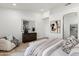 Inviting bedroom featuring hardwood floors, neutral color palette, and large windows at 8965 E Maple Dr, Scottsdale, AZ 85255