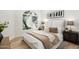 Bright bedroom featuring a large window and a plush bed with stylish decor at 8965 E Maple Dr, Scottsdale, AZ 85255