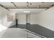Clean, well-lit garage with epoxy floors and ample space for parking and storage at 8965 E Maple Dr, Scottsdale, AZ 85255