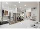 Bright kitchen with stainless steel appliances, and a view into the dining area at 8965 E Maple Dr, Scottsdale, AZ 85255