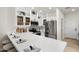 Bright kitchen features an island with a marble countertop, stainless steel appliances, and custom cabinets at 8965 E Maple Dr, Scottsdale, AZ 85255