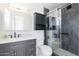 Modern bathroom features a tiled shower, sleek vanity, and matte black fixtures at 929 W Knowles Cir, Mesa, AZ 85210