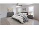 Stylishly furnished bedroom features neutral tones, ceiling fan, and an abundance of natural light at 929 W Knowles Cir, Mesa, AZ 85210