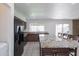 Bright kitchen with granite countertops, stainless steel appliances, and a breakfast bar seating area at 929 W Knowles Cir, Mesa, AZ 85210