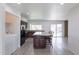 Open kitchen featuring granite countertops, dark cabinetry, and a center island with seating at 929 W Knowles Cir, Mesa, AZ 85210