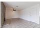 Spacious living room with tile flooring and a brick fireplace provides a flexible living space at 929 W Knowles Cir, Mesa, AZ 85210