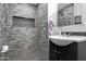 Modern bathroom featuring a tiled shower with niche and updated vanity at 1032 E Redfield Rd, Tempe, AZ 85283